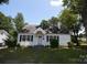 Cozy one-story home with black shutters, green grass, and a welcoming front porch at 506 Linwood Rd, Gastonia, NC 28052