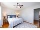 Bedroom featuring a ceiling fan and natural light with two lamps on each side of the bed at 528 Wakefield Dr # A, Charlotte, NC 28209