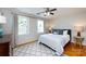 Cozy bedroom with neutral walls, large windows, and a comfortable queen-sized bed at 528 Wakefield Dr # A, Charlotte, NC 28209