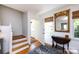Entryway featuring hardwood floors, an elegant mirror, and sunlit interiors at 528 Wakefield Dr # A, Charlotte, NC 28209