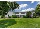 Charming townhouse with manicured lawn, mature trees, and classic architectural details at 528 Wakefield Dr # A, Charlotte, NC 28209