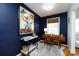 Chic office with bold blue accent wall, hardwood floors, and bright window perfect for work or study at 528 Wakefield Dr # A, Charlotte, NC 28209