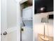 Functional laundry closet with a stacked washer and dryer unit for space-saving convenience at 528 Wakefield Dr # A, Charlotte, NC 28209