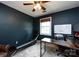 Home office with dark blue walls, a large desk, and a window for natural light, perfect for productivity at 528 Wakefield Dr # A, Charlotte, NC 28209