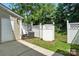 View of fenced area with access door and AC unit at 529 River Park Rd, Belmont, NC 28012