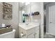 Bathroom features a white vanity sink, decor, and lighting at 529 River Park Rd, Belmont, NC 28012