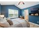 Comfortable bedroom featuring vaulted ceiling, large window and wooden floors at 529 River Park Rd, Belmont, NC 28012