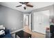 Bedroom features a ceiling fan, closet, wood flooring, neutral walls and decor at 529 River Park Rd, Belmont, NC 28012