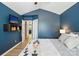 Comfortable bedroom showing vaulted ceilings, mounted TV and attached bathroom at 529 River Park Rd, Belmont, NC 28012
