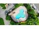 Overhead view of community cloverleaf shaped pool with lounging chairs at 529 River Park Rd, Belmont, NC 28012