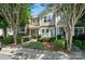 Well-kept townhome featuring beautiful stonework, manicured bushes and sidewalks at 529 River Park Rd, Belmont, NC 28012