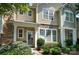 Attractive townhome with stone details and lush landscaping, creating a cozy ambiance at 529 River Park Rd, Belmont, NC 28012