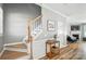 Welcoming foyer with hardwood floors, staircase, decorative accents, and access to living areas at 529 River Park Rd, Belmont, NC 28012