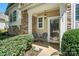 Inviting front porch with seating, decorative accents, and a welcoming entrance at 529 River Park Rd, Belmont, NC 28012