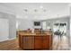 Kitchen with an island and bar top with seating in an open concept layout with sightlines to living room at 529 River Park Rd, Belmont, NC 28012