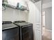 Laundry room with front loading washer and dryer with storage shelf at 529 River Park Rd, Belmont, NC 28012
