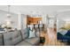 Inviting living room featuring hardwood floors, comfortable seating, and a view of the open kitchen at 529 River Park Rd, Belmont, NC 28012