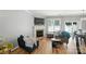Bright living room with a fireplace, large window, and comfortable seating, perfect for relaxing or entertaining guests at 529 River Park Rd, Belmont, NC 28012