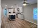 Bright kitchen with an island, stainless steel appliances, granite counters and lots of storage at 616 Laurel St, Albemarle, NC 28001