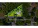 Aerial view showcasing approximate property lines of home nestled among mature trees in a residential neighborhood at 6733 Candlewood Dr, Charlotte, NC 28210