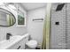 Modern bathroom with walk-in shower, black fixtures, subway tile, and natural light from the window at 6733 Candlewood Dr, Charlotte, NC 28210