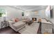 Cozy living room with fireplace, hardwood floors, and comfortable sectional sofa bathed in natural light at 6733 Candlewood Dr, Charlotte, NC 28210