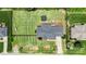 Aerial view of a home with a large, well-maintained backyard and mature landscaping at 7627 Sarah Dr, Denver, NC 28037