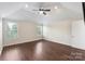 Spacious bedroom features vaulted ceiling, hardwood floors, and a ceiling fan at 7627 Sarah Dr, Denver, NC 28037