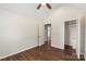 Light-filled bedroom with dark wood flooring and a door to the walk-in closet at 7627 Sarah Dr, Denver, NC 28037