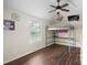 Bedroom with hardwood floors, ceiling fan, bunk bed, and natural light at 7627 Sarah Dr, Denver, NC 28037