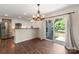 Dining area with sliding glass door and access to the kitchen with stainless steel appliances at 7627 Sarah Dr, Denver, NC 28037