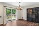 Dining area with a sliding glass door to the back deck and access to backyard at 7627 Sarah Dr, Denver, NC 28037