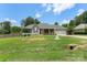 Well-maintained single-story home with a manicured lawn, fenced yard, and an attached two-car garage at 7627 Sarah Dr, Denver, NC 28037