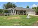 Charming single-story home featuring a covered front porch, gray siding, and a two-car garage at 7627 Sarah Dr, Denver, NC 28037