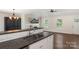 Bright, open kitchen leads into the living room with fireplace and dining area at 7627 Sarah Dr, Denver, NC 28037