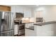 Updated kitchen features stainless steel appliances, white cabinets, and black countertops at 7627 Sarah Dr, Denver, NC 28037