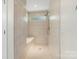 Updated shower features tile surround, built-in bench, and updated shower head at 7627 Sarah Dr, Denver, NC 28037