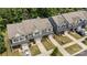 New construction townhomes feature manicured lawns, attached garages, and modern design for comfortable suburban living at 8042 Saluda Dr, Charlotte, NC 28269