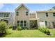 Backyard featuring a green lawn, landscaping, and a view of the home's exterior at 8042 Saluda Dr, Charlotte, NC 28269