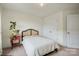 Simple bedroom featuring a bed, a side table, and a closet at 8042 Saluda Dr, Charlotte, NC 28269