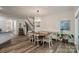 Open dining room features stylish chandelier and staircase access at 8042 Saluda Dr, Charlotte, NC 28269