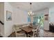 Dining room features a classic chandelier and sliding doors to patio at 8042 Saluda Dr, Charlotte, NC 28269