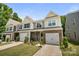 Attractive townhome featuring a well manicured lawn and attached garage at 8042 Saluda Dr, Charlotte, NC 28269