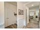 Hallway with wood floors leading into the dining room and living space at 8042 Saluda Dr, Charlotte, NC 28269