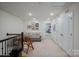 Upstairs hallway space features a seating area with natural light at 8042 Saluda Dr, Charlotte, NC 28269