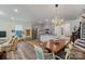 Open-concept living area with a dining space and kitchen at 8042 Saluda Dr, Charlotte, NC 28269