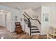 View of well-lit staircase with decorative accents at 8042 Saluda Dr, Charlotte, NC 28269