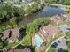 Aerial view of complex with a community pool and lake at 8135 Cedar Glen Dr, Charlotte, NC 28212