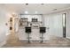 Bright kitchen with white cabinetry, a breakfast bar, and stainless steel appliances at 8135 Cedar Glen Dr, Charlotte, NC 28212