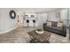 Open living room with a view of a modern kitchen and a comfortable couch at 8135 Cedar Glen Dr, Charlotte, NC 28212